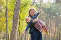 Happy mother playing with his daughter in the park  in summer day Royalty Free Stock Photo