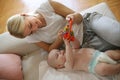 Happy mother plying with her little baby boy at home Royalty Free Stock Photo