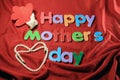 Happy Mother`s Day alphabet blocks arranged on red background. Mother`s day gift box. Happy Mother`s day concept. Royalty Free Stock Photo