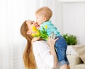 Happy mother`s day. Baby son gives flowers for mom Royalty Free Stock Photo