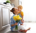 Happy mother`s day! baby son gives flowersfor mother on holiday Royalty Free Stock Photo