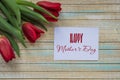 Happy Mother`s Day card with red tulips