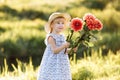 Happy mother`s day. Child daughter congratulates mom and gives her a bouquet of flowers outdoors. Mum and girl smiling and huggin Royalty Free Stock Photo