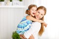 Happy mother`s day! Child daughter congratulates moms and gives Royalty Free Stock Photo