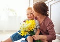 Happy mother`s day! child son gives flowersfor  mother on holiday Royalty Free Stock Photo