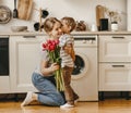 Happy mother`s day! child son gives flowers for mother on holiday