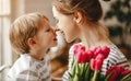 Happy mother`s day! child son gives flowers for  mother on holiday Royalty Free Stock Photo