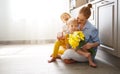 Happy mother`s day! Children congratulates moms and gives her a Royalty Free Stock Photo