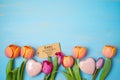 Happy Mother`s day concept with beautiful tulip flowers on wooden background Royalty Free Stock Photo