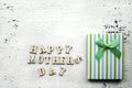 Happy mother`s day. Congratulations holiday mom. Gift striped box with bow.