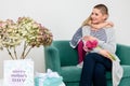 Happy Mother`s Day. Cute little girl congratulating mom to mothers day. Mother and daughter at home. Royalty Free Stock Photo