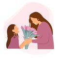 Happy mother\'s day. Daughter give her mum flowers.Tulips