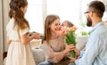 Happy mother`s day! father and children congratulate mother on holiday Royalty Free Stock Photo
