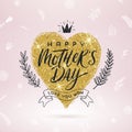 Happy mother`s day - Greeting card. Brush calligraphy on a glitter gold shinning heart and hand drawn floral decor. Royalty Free Stock Photo