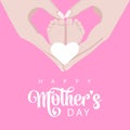 Mother\'s day mother\'s hands hold the legs of the smal children she loves in pink and white colors