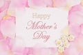 Happy Mother`s Day greeting card on pink rose flower petals Royalty Free Stock Photo