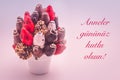 Happy mother`s day greeting card that reads Anneler gununuz kutlu olsun with red lettering; A bundle of edible flowers,