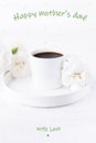 Happy mother`s day greeting card. White cup of black coffee and carnations flowers on a white background Royalty Free Stock Photo