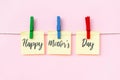 Happy Mother`s Day greeting text on hanging paper note