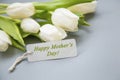 Happy Mother`s Day greeting with white tulips bouquet