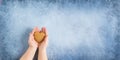 Happy mother`s day.Heart in the hands of daughter and mother on a blue background.I love you.Love and health in the Royalty Free Stock Photo