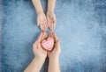 Happy mother`s day.Heart in the hands of daughter and mother on a blue background.I love you.Love and health in the family.Banner Royalty Free Stock Photo