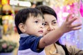 Asian boy raised his hands for grabbing something Royalty Free Stock Photo