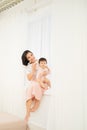 Happy mother`s day! Mom and her daughter child girl are playing, smiling and hugging Royalty Free Stock Photo