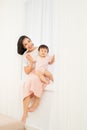 Happy mother`s day! Mom and her daughter child girl are playing, smiling and hugging Royalty Free Stock Photo