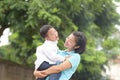 Happy mother`s day.Mother holding her son with love and happiness in the park.Family holiday and togetherness Royalty Free Stock Photo