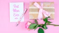 Mother`s Day overhead with roses, Best Mom Ever card and gift on pink table. Royalty Free Stock Photo