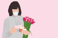 Happy Mother`s day in quarantine. Woman in face mask with greeting card and tulips bouquet on pink background, healthy receiving