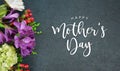 Happy Mother`s Day Text with Flowers Bouquet and Black Texture Background