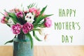 Happy Mother`s Day text sign on beautiful double peony tulips bouquet in vase in light. Stylish floral greeting card. Thank you, Royalty Free Stock Photo