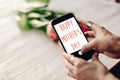 Happy mother`s day text sign on screen of phone. hand holding ga Royalty Free Stock Photo