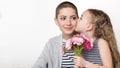 Happy Mother`s Day, Women`s day or Birthday background. Cute little girl giving mom, cancer survivor, bouquet of gerbera daisies. Royalty Free Stock Photo
