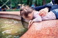 Happy mother and small daugher in a park Royalty Free Stock Photo
