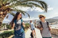 Mother, son and daughter walking together at seaside with luggage backpack. Travel, tourism,  family concept Royalty Free Stock Photo