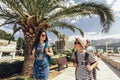 Mother, son and daughter walking together at seaside with luggage backpack. Travel, tourism,  family concept Royalty Free Stock Photo