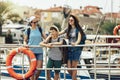 Mother, son and daughter walking together at seaside with luggage backpack. Travel, tourism,  family concept Royalty Free Stock Photo