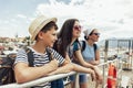 Mother, son and daughter walking together at seaside with luggage backpack. Travel, tourism,  family concept Royalty Free Stock Photo