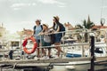 Mother, son and daughter walking together at seaside with luggage backpack. Travel, tourism,  family concept Royalty Free Stock Photo