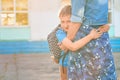 Happy mother and son family. boy hugs his mother, an elementary school student