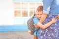 Happy mother and son family. boy hugs his mother, an elementary school student