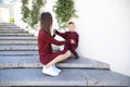 Happy mother with son in fashionable clothes family look in a park Royalty Free Stock Photo