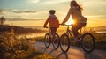 Happy mother and son go in sports outdoors. Boy and mom rides bike in helmets. Silhouette family at sunset. Fresh air. Generative