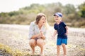Happy Mother and son have a rasting at the beach Royalty Free Stock Photo