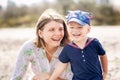 Happy Mother and son have a rasting at the beach Royalty Free Stock Photo