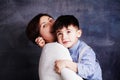 Happy mother and son having fun, laughing and hugging. Beautiful woman and her cute little child boy playing and smiling Royalty Free Stock Photo