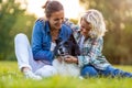 Mother and son outdoors petting their dog Royalty Free Stock Photo